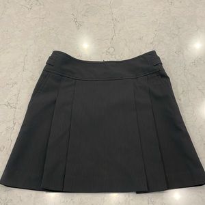 Express Design Studio Black pleated pinstripe skirt w/ side pockets.